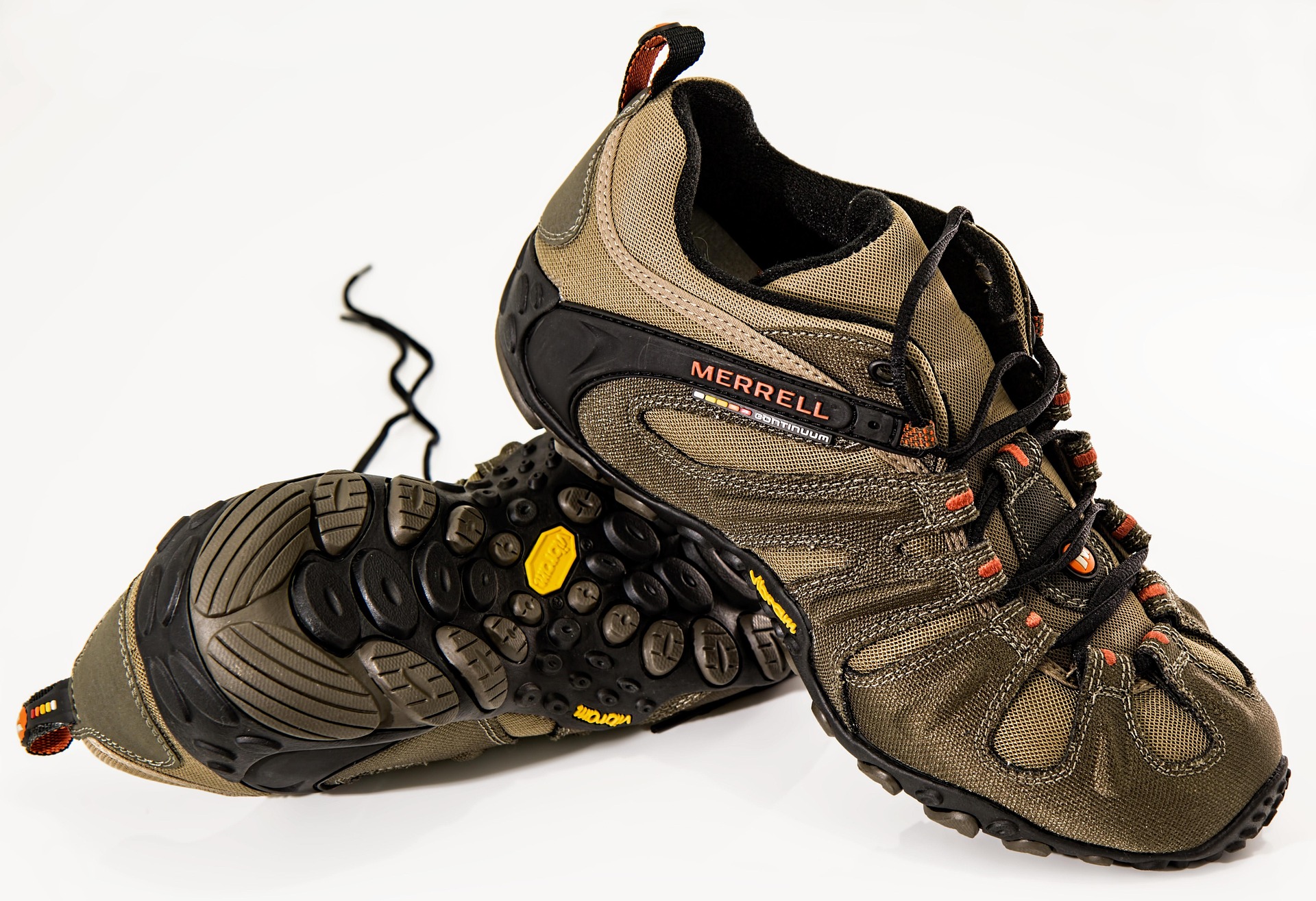 A pair of Merrell hiking shoes shown on a white background